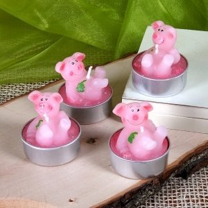 4 Schweine-Teelichter mit Glücksklee