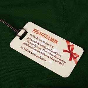 Reisegutschein mit Weltkarte und Schleif